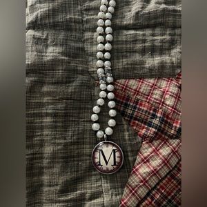 Necklace with letter M pendant